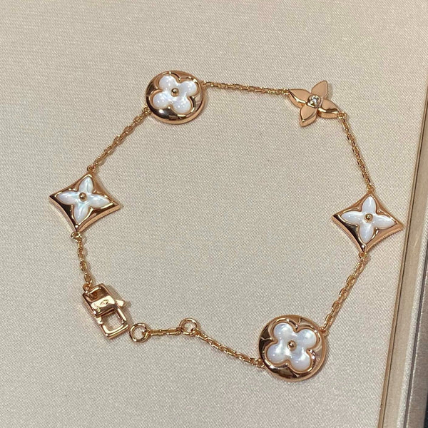 ˇGilded EraˇSTAR AND SUN 5 MOTIF MOP PINK GOLD BRACELET