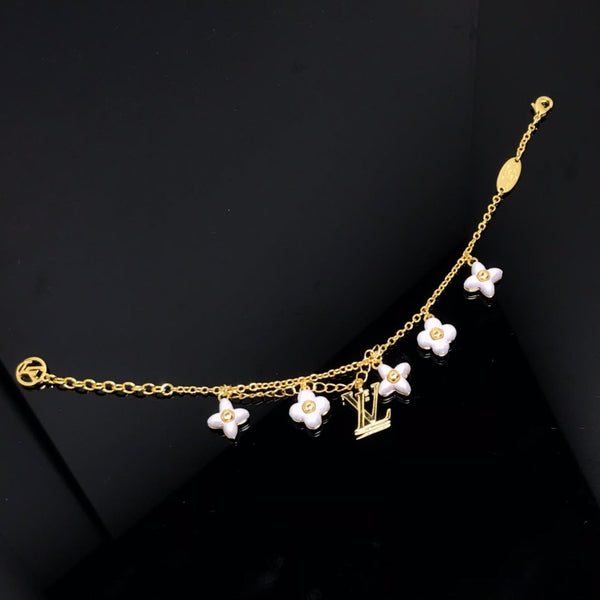 ˇGilded EraˇLOGO 6 MOTIF STAR AND SUN GOLD BRACELET